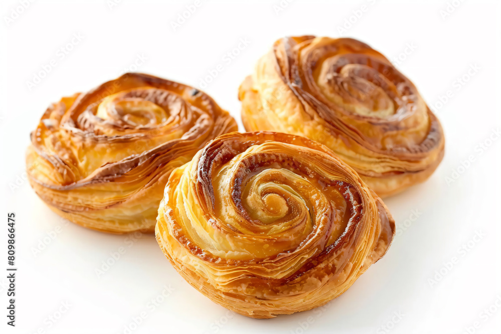 three pastries are sitting on a white surface three pastries are sitting on a white surface