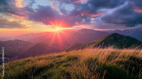 A beautiful mountain landscape with a bright sun shining on the grassy hill. The sun is setting  creating a warm and peaceful atmosphere