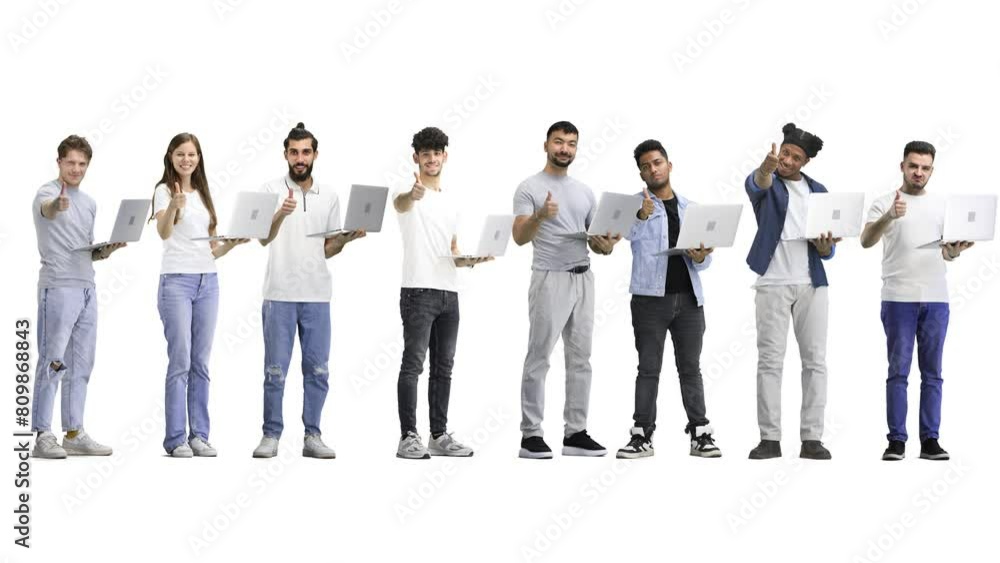 A group of people, full-length, on a white background, show a thumbs up with a laptop A group of people, full-length, on a white background, show a thumbs up with a laptop