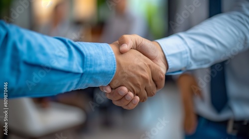 Close up of hands shaking on business deal, man handing over to other person isolated against . Businessman giving cash forcape and handshake in office .