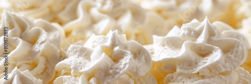 Indulge in the fluffy delight of whipped cream, its creamy texture and light aroma enchanting photo