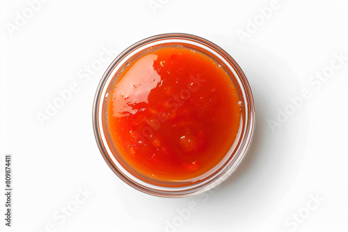a jar of tomato sauce on a white surface
