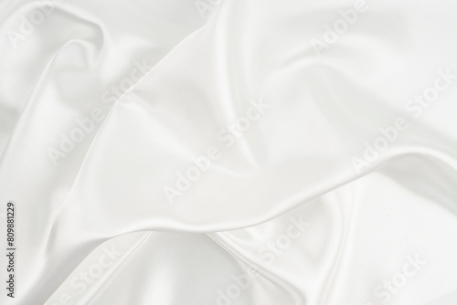 White satin silk wrinkled texture as background