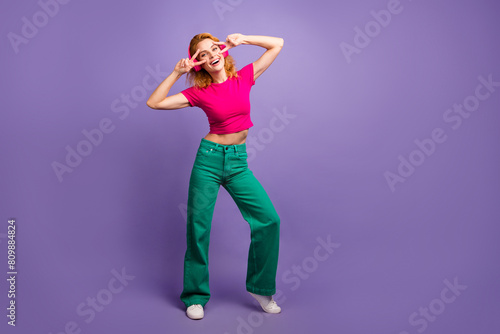 Photo of lovely charming positive woman wear stylish pink clothes dance night club music isolated on purple color background