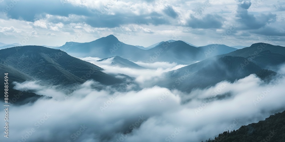 Majestic fog-covered mountain landscape, soothing blues and greens, ideal for quiet contemplation and nature themes, expansive sky overhead. Majestic fog-covered mountain landscape, soothing blues and greens, ideal for quiet contemplation and nature themes, expansive sky overhead.
