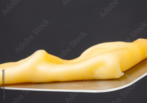 Close up cheese melting on spatula © musicphone1