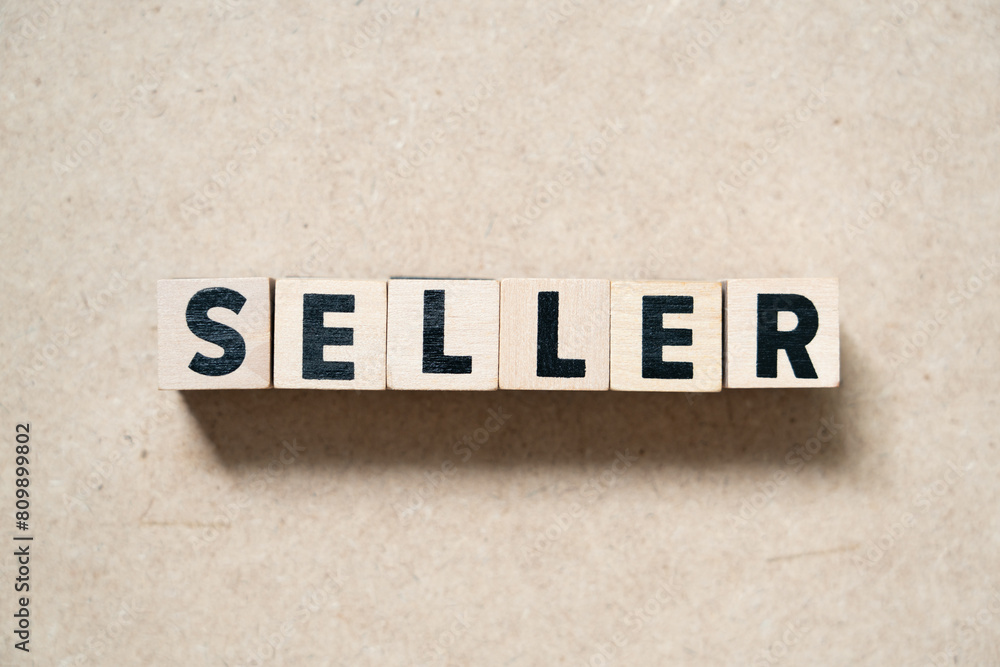 Alphabet letter block in word seller on wood background Alphabet letter block in word seller on wood background