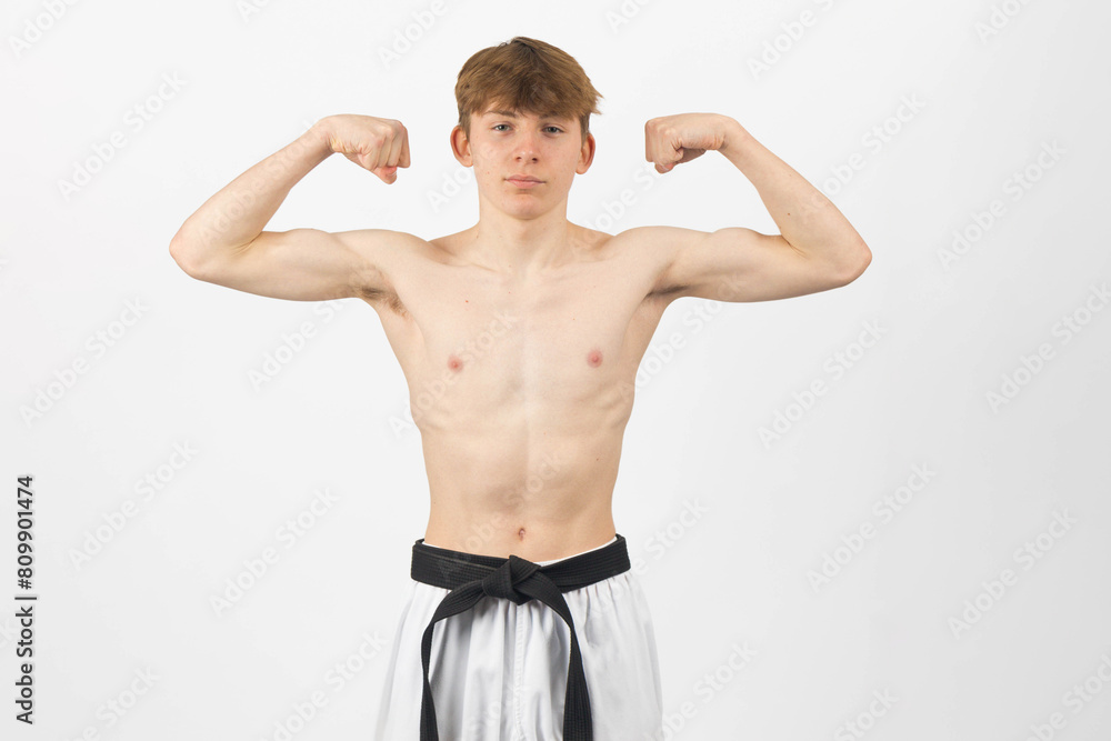 Naklejka premium A Shirtless Teenage Karate Boy