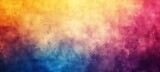 The image is a watercolor painting with a gradient of yellow, orange, pink, purple, blue and green. It has a rough, textured surface and looks like it was painted on a canvas.
