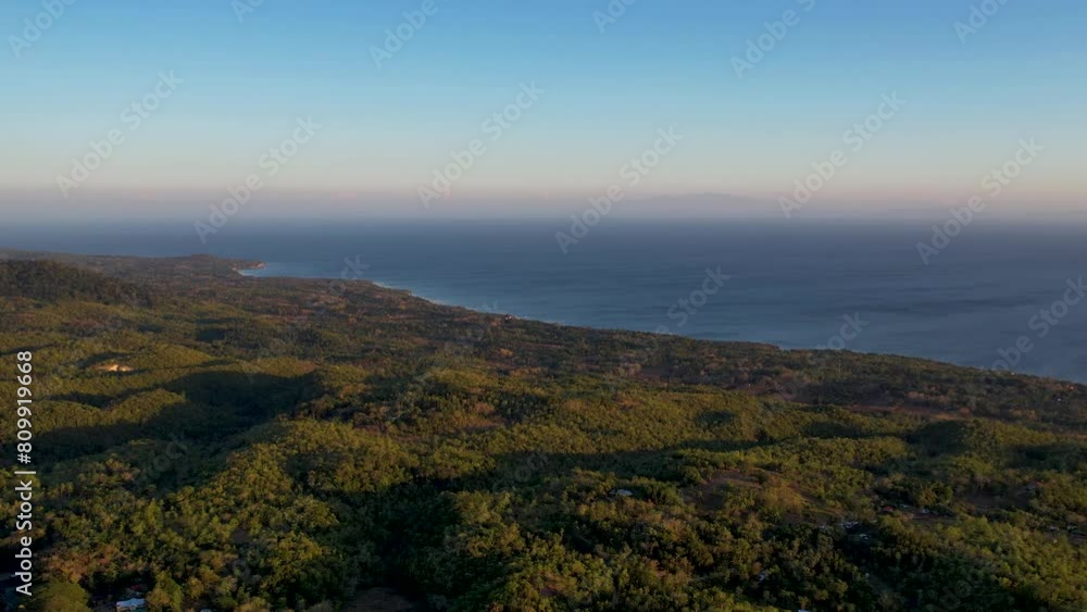 4K Aerial Drone video of the coast of Siquijor island at golden hour with lush jungle and palm trees overlooking the horizon, Philippines 4K Aerial Drone video of the coast of Siquijor island at golden hour with lush jungle and palm trees overlooking the horizon, Philippines