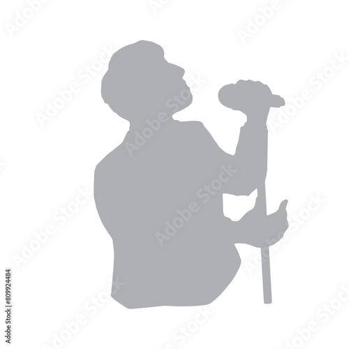 マイクを持って語るあるいは歌を歌う男性のシルエットイラスト　グレー