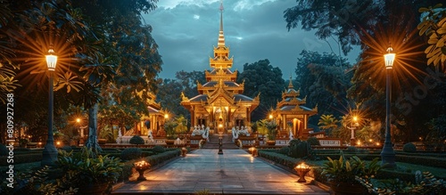 Golden Temple Glows in Serene Nighttime Garden Landscape photo