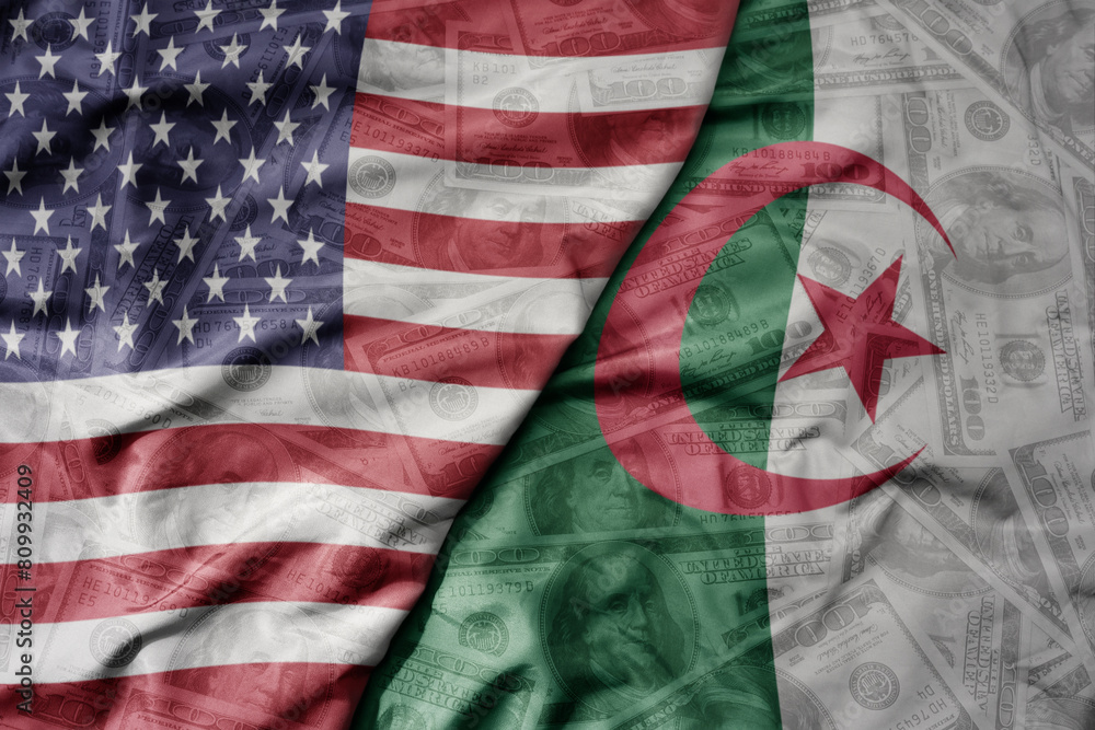 Obraz premium big waving colorful flag of united states of america and national flag of algeria on the dollar money background. finance concept .