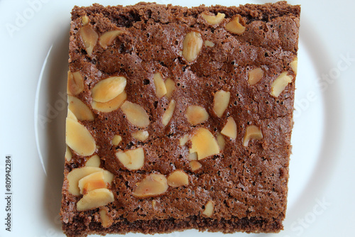 Brownies cake with almond topping, big square cut, flat lay or top view