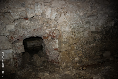 excursion to the ruins of an old castle, basement, failures in the walls, arches, wall, stonework, destruction photo