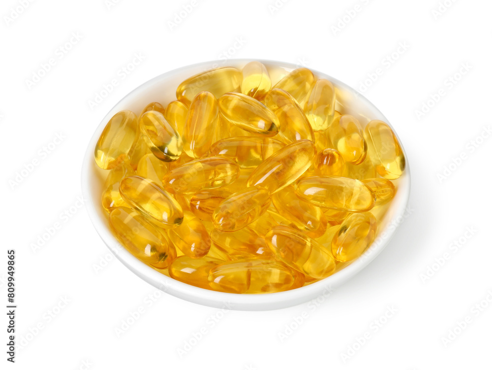 Vitamin capsules in bowl isolated on white. Health supplement Vitamin capsules in bowl isolated on white. Health supplement