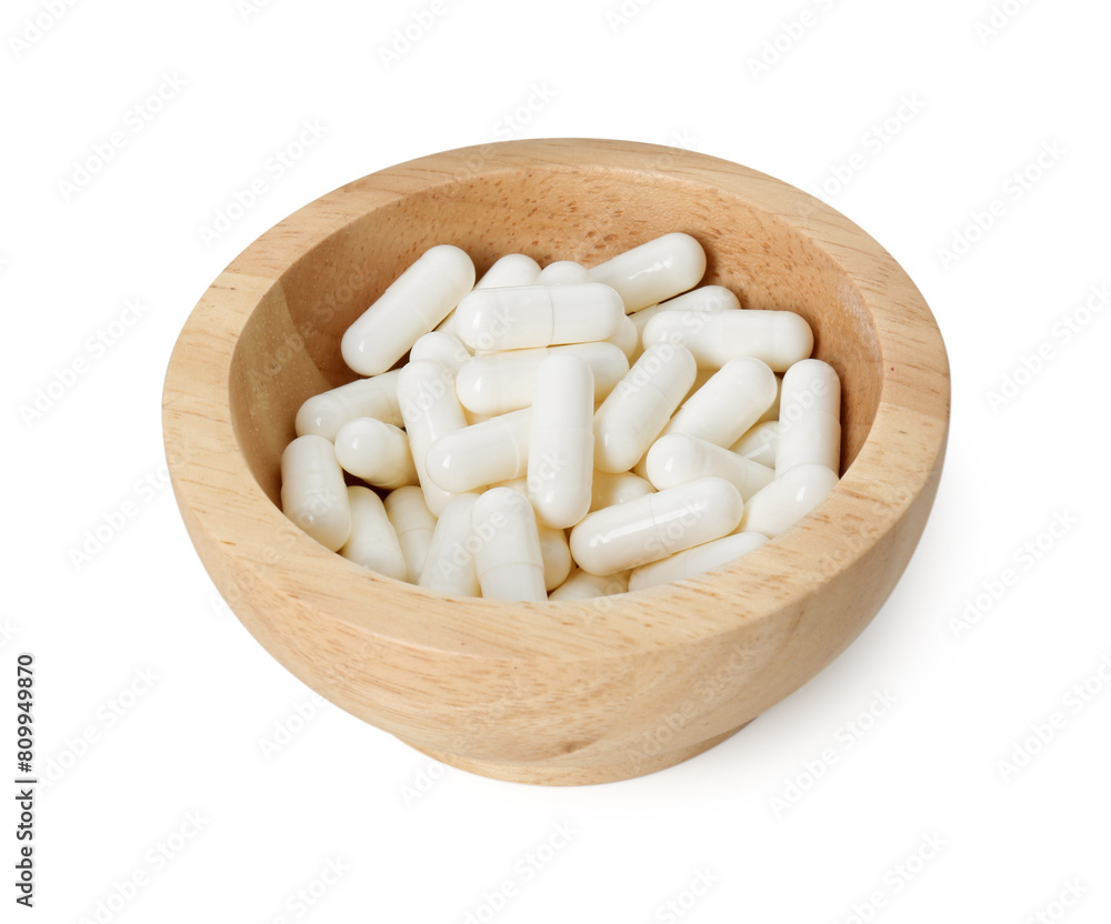Vitamin capsules in bowl isolated on white. Health supplement Vitamin capsules in bowl isolated on white. Health supplement