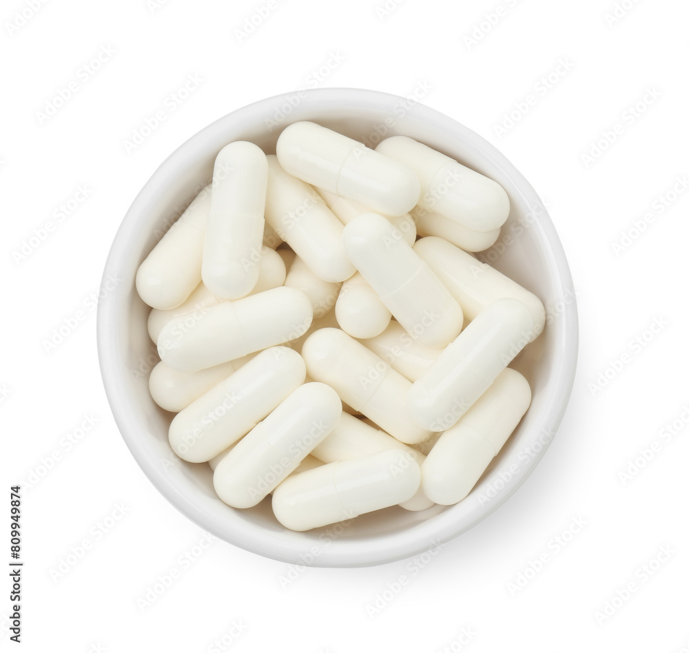 Vitamin capsules in bowl isolated on white, top view. Health supplement Vitamin capsules in bowl isolated on white, top view. Health supplement