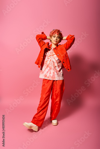 Принти на полотні A woman in red pants and a red jacket exudes extravagance and vibrancy