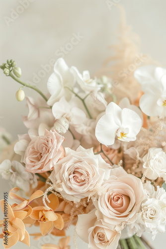 Close-up image of white and light orange orchids and pink roses