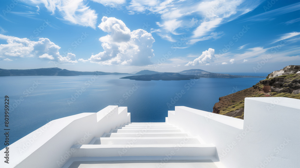 Fototapeta premium White stone staircases outside a traditional Mediterranean style building overlooking the sea.