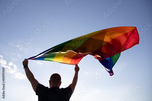 Young man with LGBT flag.