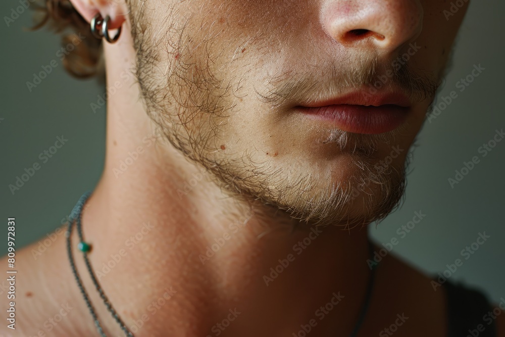 Obraz premium Young man with ear piercing