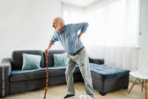 back painbackpain walking stick cane senior mature elderly heath ache backache elderly painful retirement
