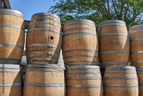 wine barrels stacked in an open-air vineyard in Mendoza, Argentina