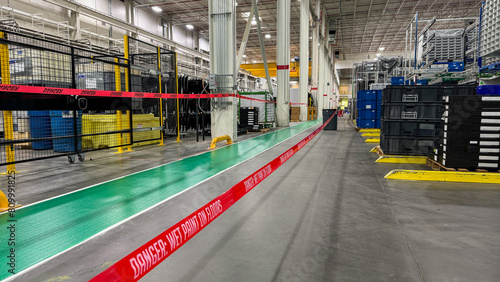 recently coated wet floor safety tape in warehouse photo