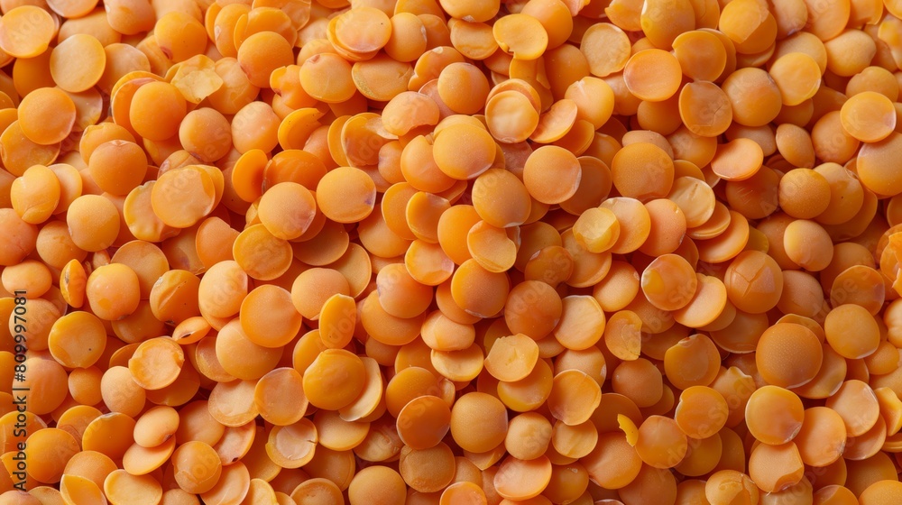 A tight shot of halved carrots forming a small pile A tight shot of halved carrots forming a small pile