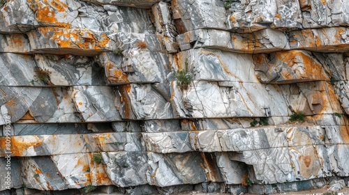  A tight shot of a rock formation, adorned with orange and white paint on its sides Atop the painted rock, a bird rests comfortably
