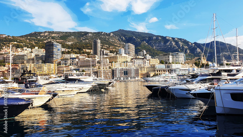 Morning view on boats and yachts    (sailboats|) in Hercule port and buildings of Monaco and Monte Carlo in right direction