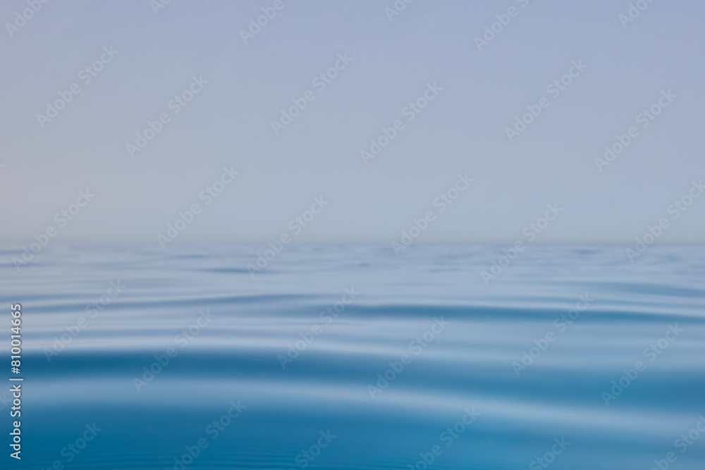 Quiet blue ocean horizon with very small waves Quiet blue ocean horizon with very small waves