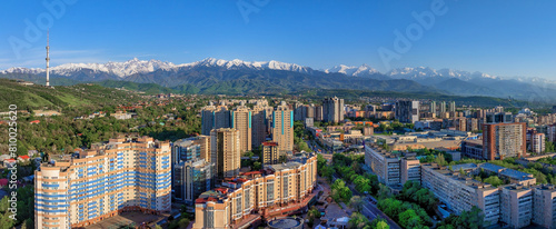 Panoramic view from a quadcopter of the southern part of the largest Kazakh city of Almaty on a spring evening