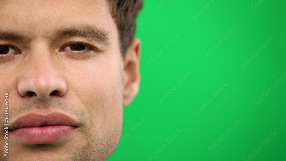 Man's eyes, on a green background, close-up, eyes open Man's eyes, on a green background, close-up, eyes open