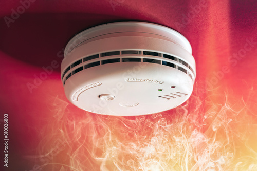 Smoke alarm detector and interlinked fire alarm in action background