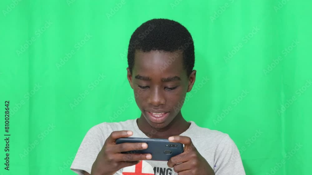 young boy with a cell phone. young boy with a cell phone.