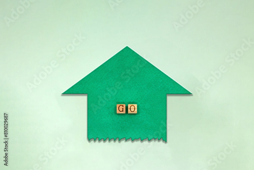 GOの英語ブロックが中心にある上に向かう緑色の矢印がテープ風に切られた素材 photo