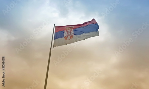 Serbian flag flies in the sky