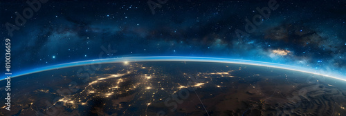 A panoramic view of the Earth's curvature with the thin blue line of the thermosphere visible, under a star-filled sky photo