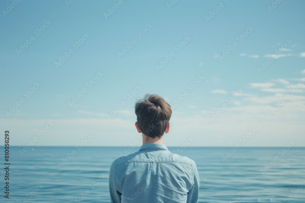 A contemplative young man gazes at the vast blue ocean, a scene of serene solitude and expansive calm, perfect for themes of reflection and nature.
A contemplative young man gazes at the vast blue ocean, a scene of serene solitude and expansive calm, perfect for themes of reflection and nature.