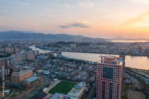 Skyline cityscape view by Fukuoka tower at sunset golden hour, Japan © Blanscape