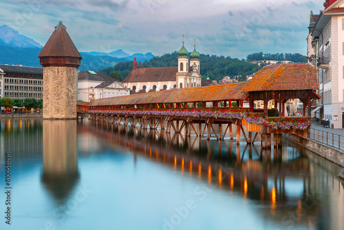 Twilight view of historic Chapel Bridge and Water Tower in Lucerne, Switzerland (ID: 810058098)
