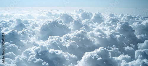 A surreal view of stratocumulus clouds from above, with their cotton-like texture and vast expanse, covering the ocean below photo