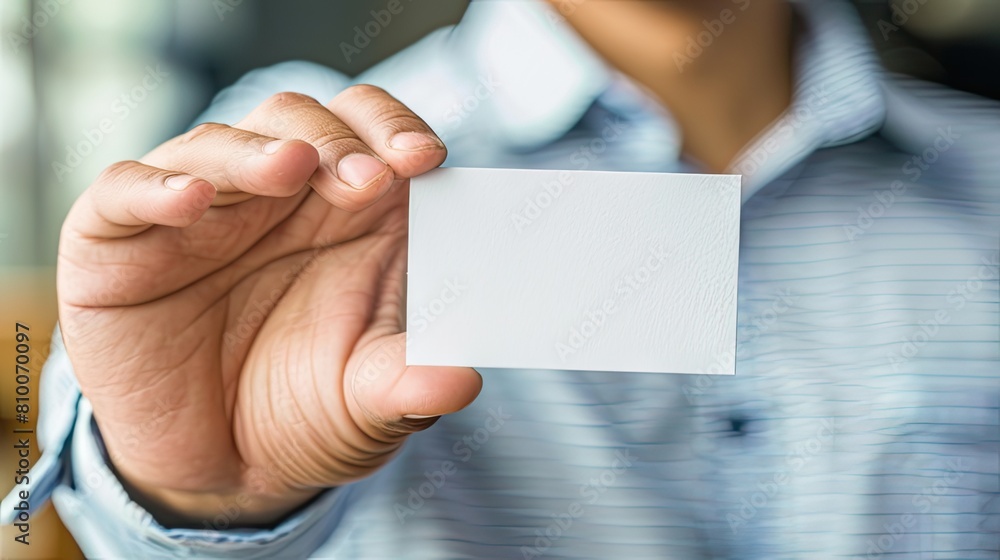 The Power of Connection: Man Holding Business Card The Power of Connection: Man Holding Business Card