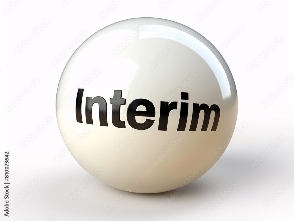 A silver object with the word INTERIM written on it. The object has a round shape A silver object with the word INTERIM written on it. The object has a round shape