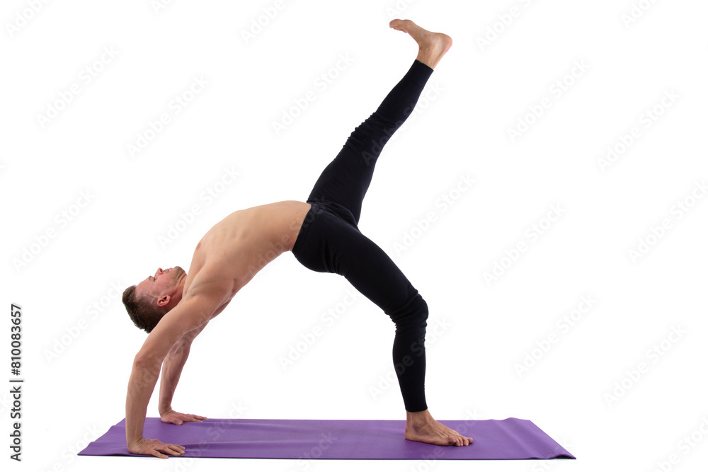 A young attractive man with an athletic body is doing fitness. White background. A young attractive man with an athletic body is doing fitness. White background.