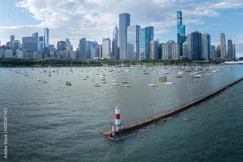 Aerial view of downtown Chicago, Illinois, USA. Over Lake Michigan looking towards small lighthouse and boats. September 26, 2023. 