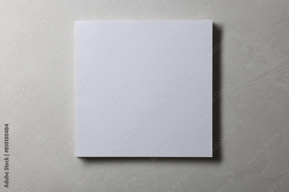 Fototapeta premium Blank paper sheets on grey textured background, top view. Mockup for design